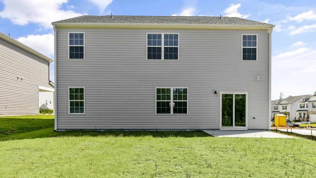 Exterior details and patio area of a home in The Grove at Matthews Landing, Fuquay Varina (Image 4).