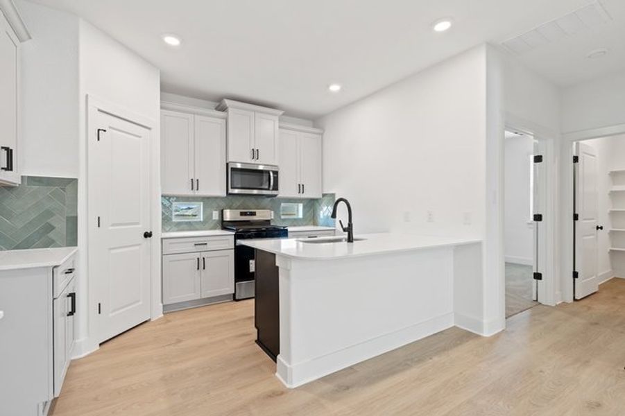 Furnished interior view inside a new home in Crosswinds, Kyle (Image 11).