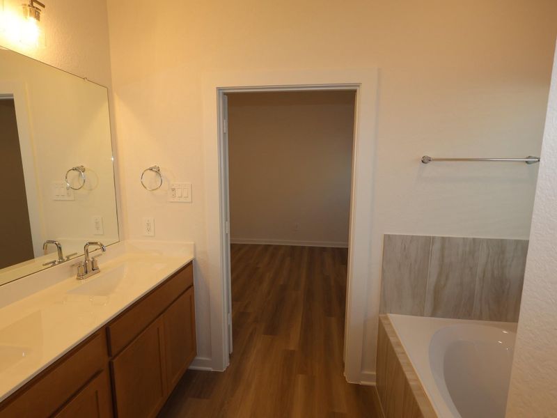 Furnished interior view inside a new home in Lone Star Landing, Montgomery (Image 7).