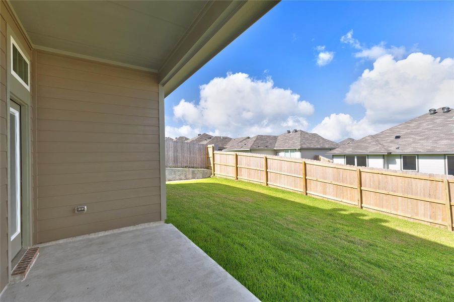 Exterior details and patio area of a home in Vintage Farms, Brenham (Image 28).