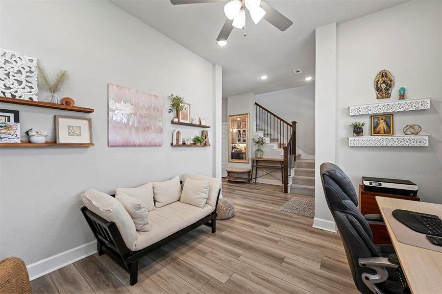 Office space with wood finished floors, a ceiling fan, and recessed lighting Office space with wood finished floors, a ceiling fan, and recessed lighting