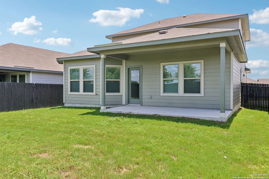 Front exterior of a new home in Remington Ranch, San Antonio, TX, highlighting curb appeal (Image 25). Front exterior of a new home in Remington Ranch, San Antonio, TX, highlighting curb appeal (Image 25).