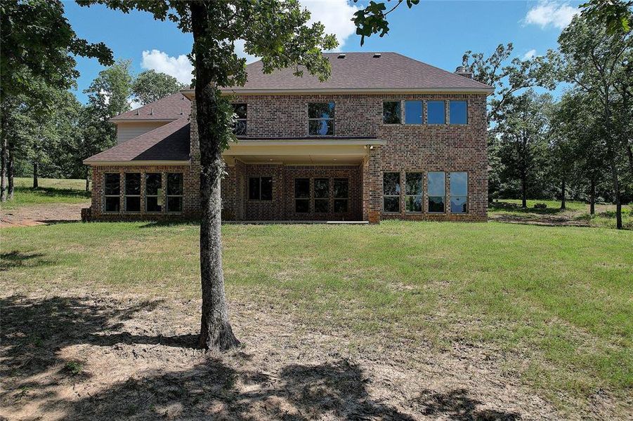 Front exterior of a new home in , Malakoff, TX, highlighting curb appeal (Image 24). Front exterior of a new home in , Malakoff, TX, highlighting curb appeal (Image 24).