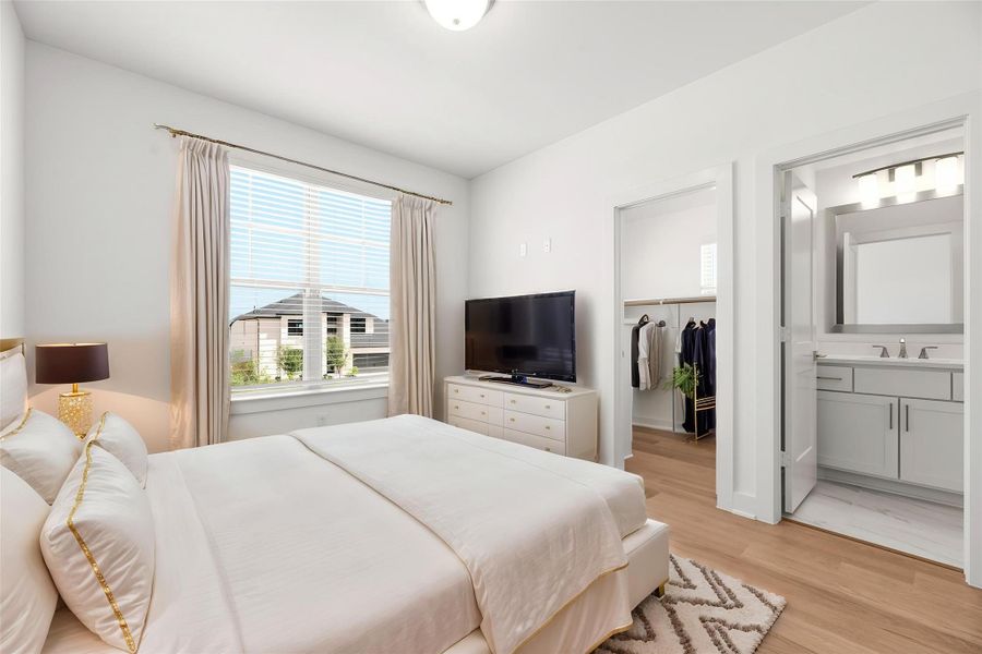 Comfort meets convenience in this spacious secondary bedroom, featuring private ensuite access and modern finishes that provide a welcoming retreat for guests. Virtually staged.
