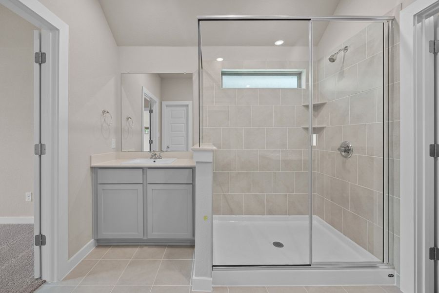 Primary Bath in the Brazos home plan by Trophy Signature Homes – REPRESENTATIVE PHOTO