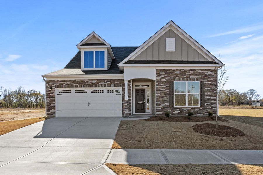 Front exterior of a new home in Founders Club, Moore, SC, highlighting curb appeal (Image 1). Front exterior of a new home in Founders Club, Moore, SC, highlighting curb appeal (Image 1).