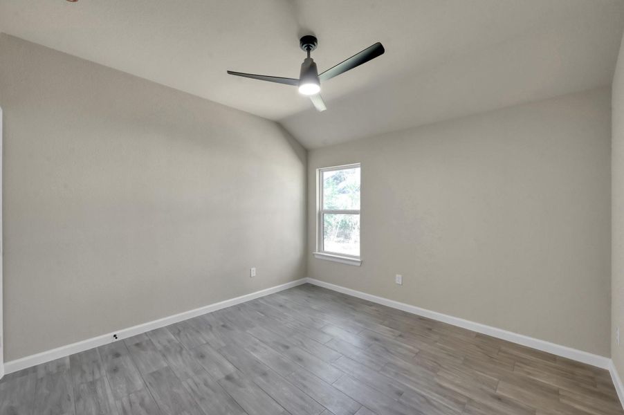 Highlighting the architectural details, this view showcases the high ceilings and modern fixtures that give every room in this home an upscale, custom-built feel.