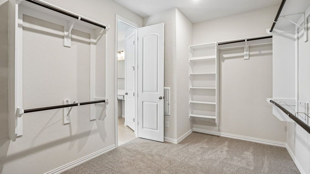 Spacious Owner's Closet with Built-in Shelving