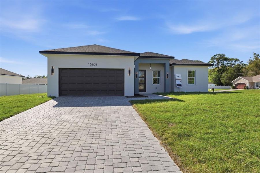 Front exterior of a new home in , Ocala, FL, highlighting curb appeal (Image 19).