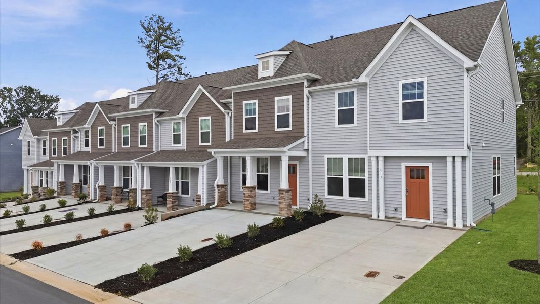 Front exterior of a new home in Clarke Townes, Anderson, SC, highlighting curb appeal (Image 2). Front exterior of a new home in Clarke Townes, Anderson, SC, highlighting curb appeal (Image 2).