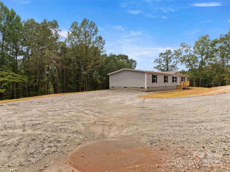 Front exterior of a new home in , Mill Spring, NC, highlighting curb appeal (Image 12). Front exterior of a new home in , Mill Spring, NC, highlighting curb appeal (Image 12).