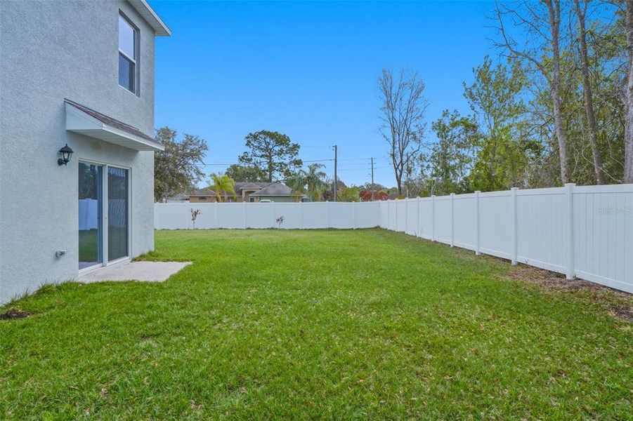Exterior details and patio area of a home in Poinciana Enclave, Kissimmee (Image 18).