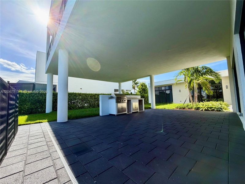 Exterior details and patio area of a home in , Weston (Image 29). Exterior details and patio area of a home in , Weston (Image 29).