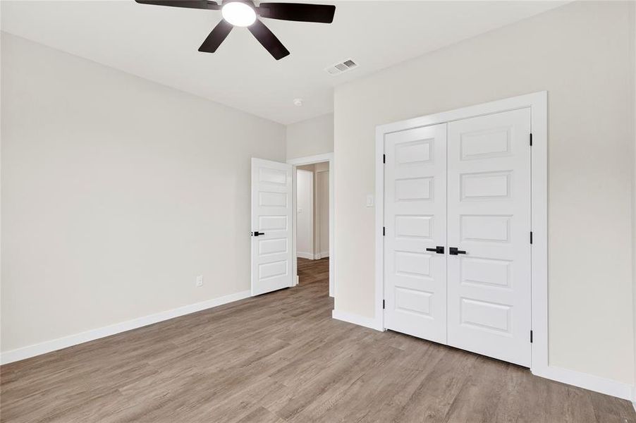 Neutral tone wall paint with white trim
