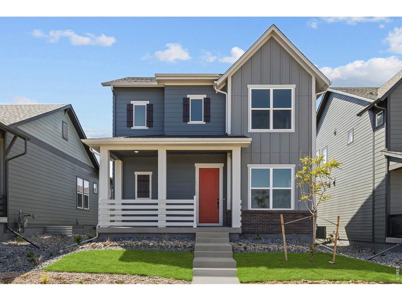 Front exterior of a new home in Kinston Cottage, Loveland, CO, highlighting curb appeal (Image 30). Front exterior of a new home in Kinston Cottage, Loveland, CO, highlighting curb appeal (Image 30).