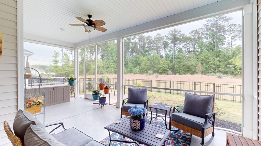Exterior details and patio area of a home in Summerwind Crossing at Lakes of Cane Bay, Summerville (Image 26).