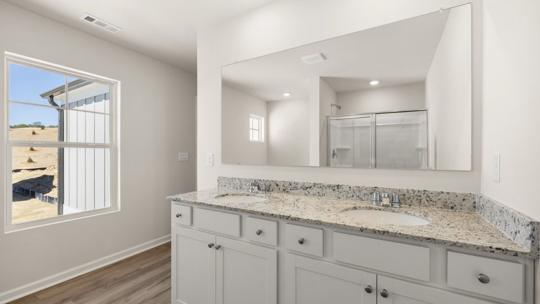 Representative furnished interior of a home built from the Flora by D.R. Horton in Sheffield Highlands, Dallas (Image 11).