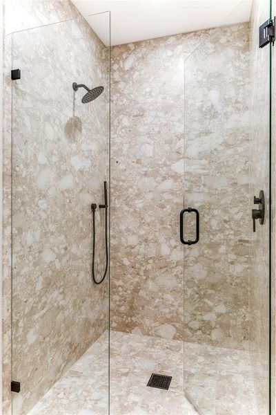 Full bathroom featuring a stall shower