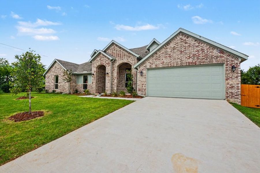 Front exterior of a new home in Cole Crossing Estates, DeSoto, TX, highlighting curb appeal (Image 18). Front exterior of a new home in Cole Crossing Estates, DeSoto, TX, highlighting curb appeal (Image 18).