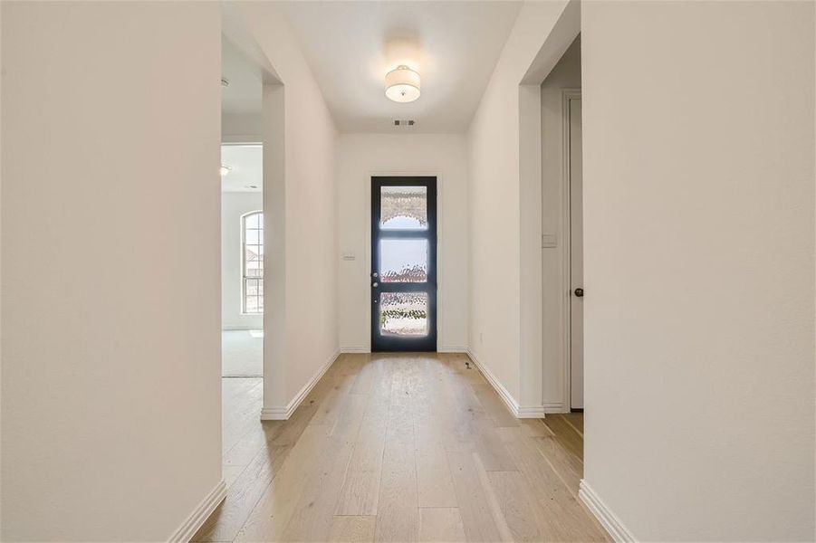 Entryway with light wood-type flooring