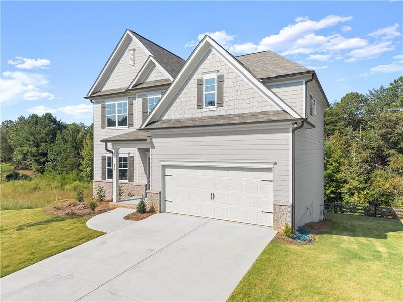 Front exterior of a new home in , Dawsonville, GA, highlighting curb appeal (Image 2). Front exterior of a new home in , Dawsonville, GA, highlighting curb appeal (Image 2).