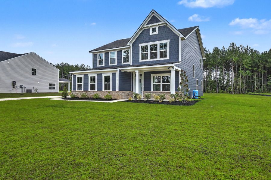 Front exterior of a new home in , Ridgeville, SC, highlighting curb appeal (Image 2). Front exterior of a new home in , Ridgeville, SC, highlighting curb appeal (Image 2).