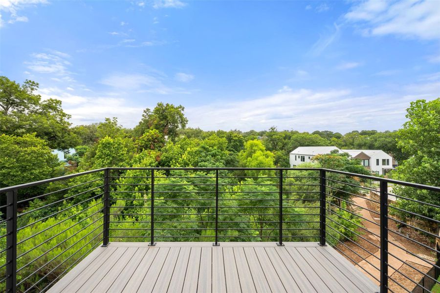 Enjoy tranquil treetop views from this private, elevated outdoor deck. Enjoy tranquil treetop views from this private, elevated outdoor deck.