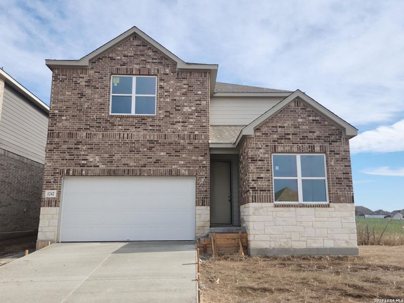 Front exterior of a new home in Arcadia Ridge, San Antonio, TX, highlighting curb appeal (Image 8). Front exterior of a new home in Arcadia Ridge, San Antonio, TX, highlighting curb appeal (Image 8).