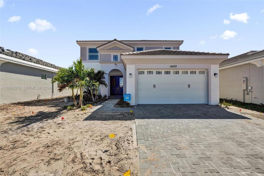 Front exterior of a new home in , Westlake, FL, highlighting curb appeal (Image 1). Front exterior of a new home in , Westlake, FL, highlighting curb appeal (Image 1).