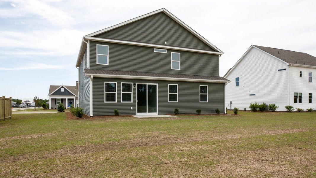 Front exterior of a new home in Surfside Landing, Hubert, NC, highlighting curb appeal (Image 2).