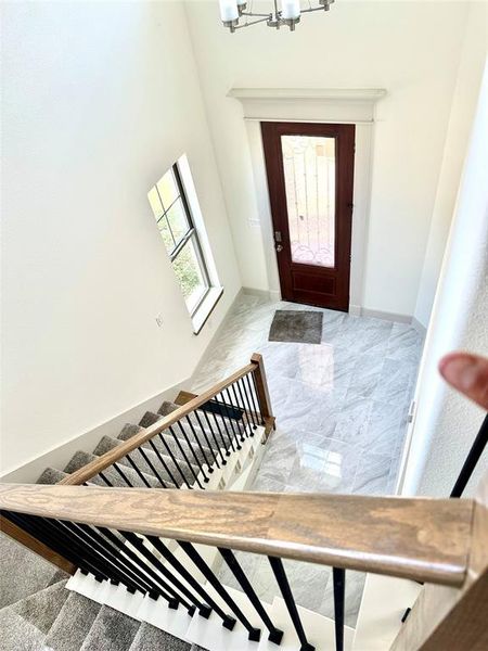 Entrance foyer with a notable chandelier