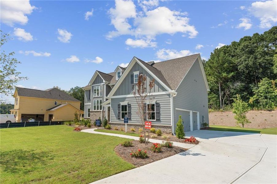 Front exterior of a new home in Oak Valley Estates, Marietta, GA, highlighting curb appeal (Image 1).