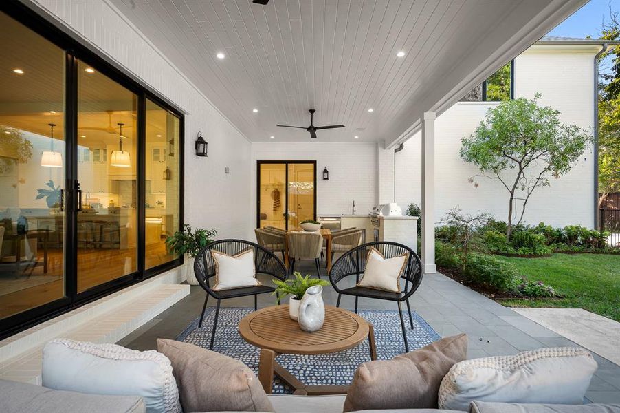 View of patio featuring ceiling fan and an outdoor hangout area