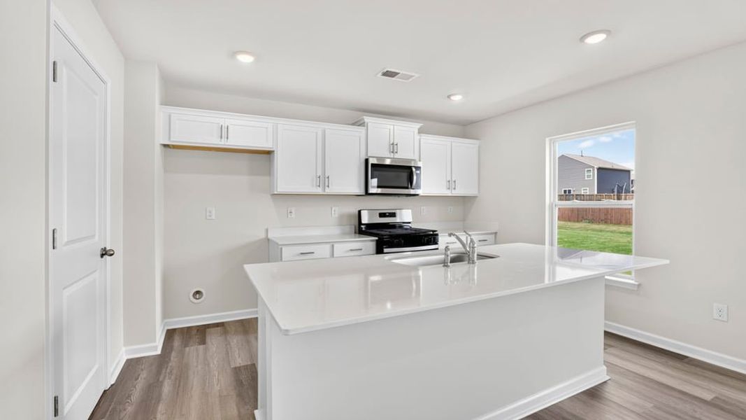 Furnished interior view inside a new home in Bentley Park, Greenwood (Image 9).