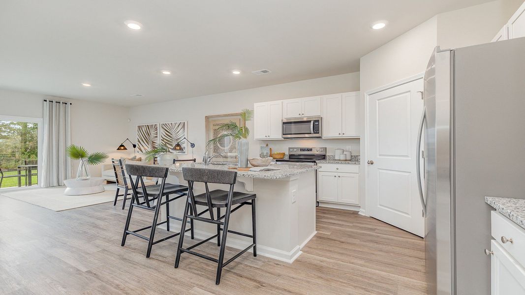 Furnished interior view inside a new home in Rich Square at Brunswick Plantation, Ash (Image 4).