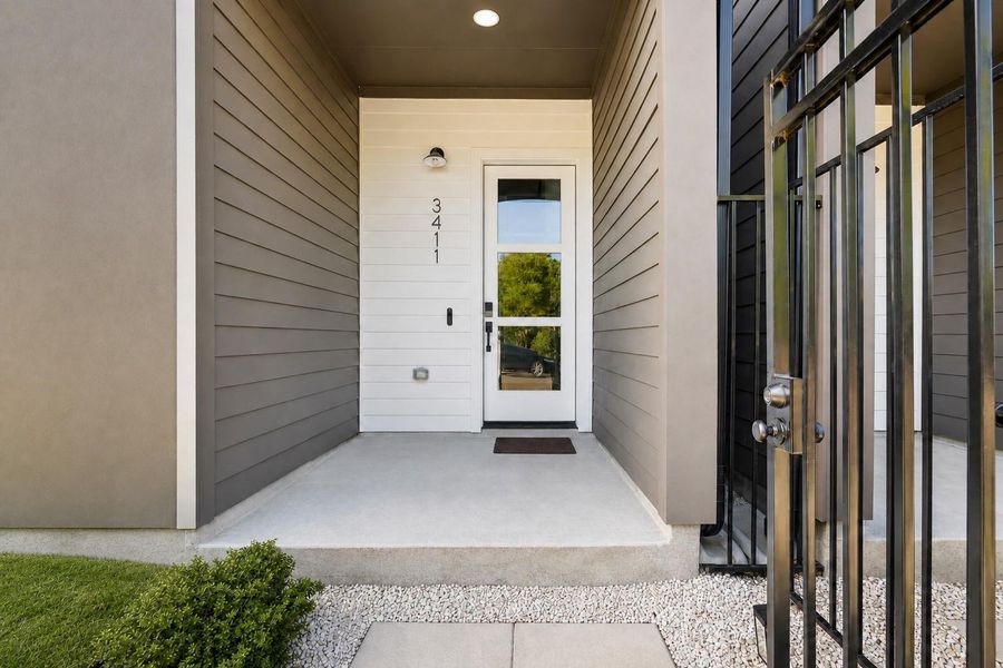 A warm wood inspired palette, soaring ceilings, and curated architectural details establish the home’s sophisticated modern aesthetic from the moment you step inside.