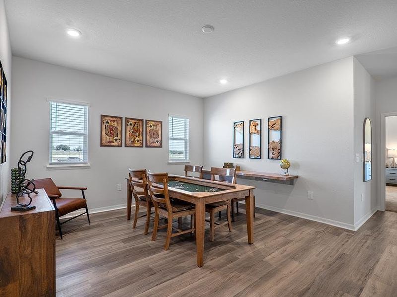 A living room provides a formal or flexible-use space - Monroe by Highland Homes