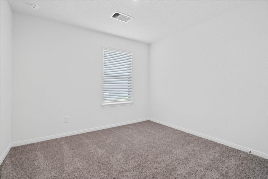 Clean neutral tones and great natural light make this additional bedroom ready for your personal touch!