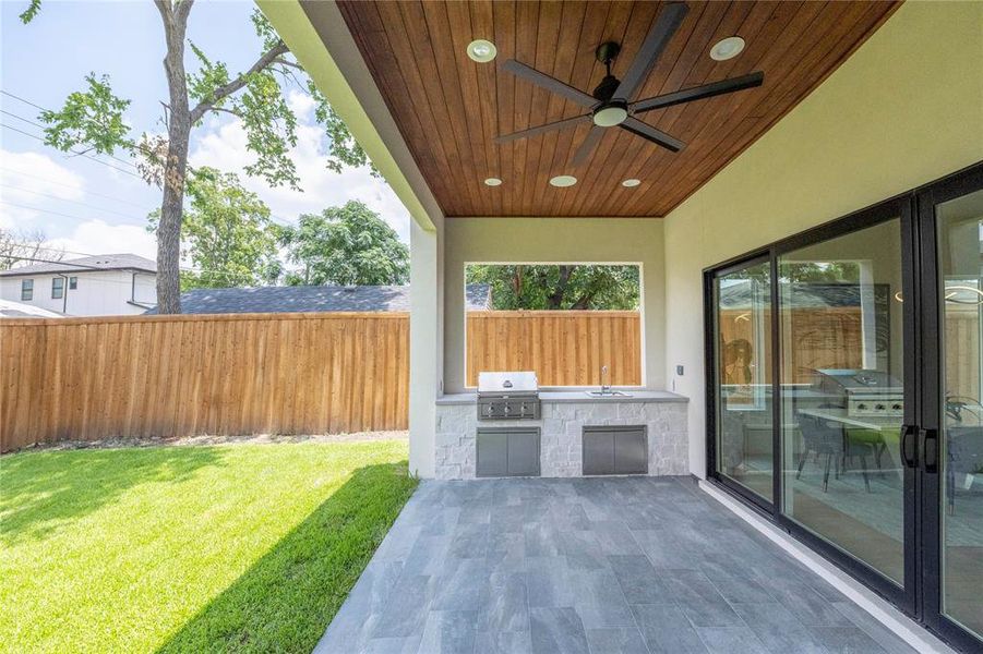 View of terrace featuring grilling area, area for grilling, and ceiling fan