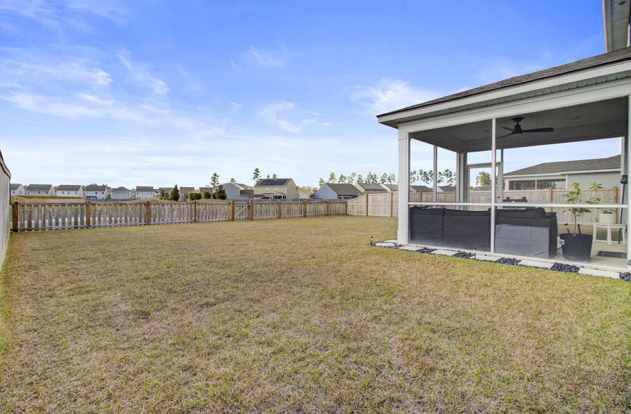 Exterior details and patio area of a home in Sanctuary Cove at Cane Bay, Summerville (Image 26).