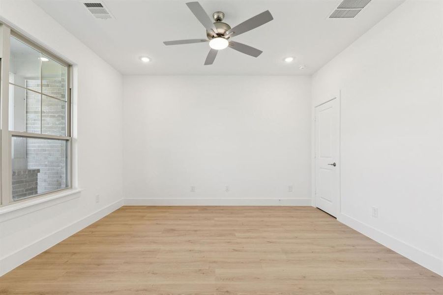 Unfurnished room featuring light wood finished floors, recessed lighting, and a ceiling fan