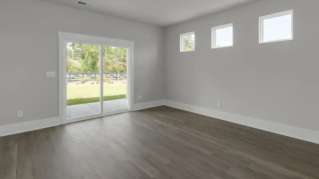Spacious, unfurnished interior of a new home in The Retreat at Indigo Preserve Townhomes, Leland (Image 11).