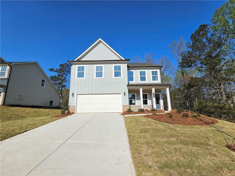 Front exterior of a new home in The Estates at Casteel, Bethlehem, GA, highlighting curb appeal (Image 11).