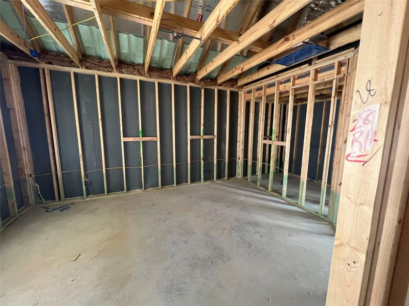 Miscellaneous room with concrete flooring and a garage