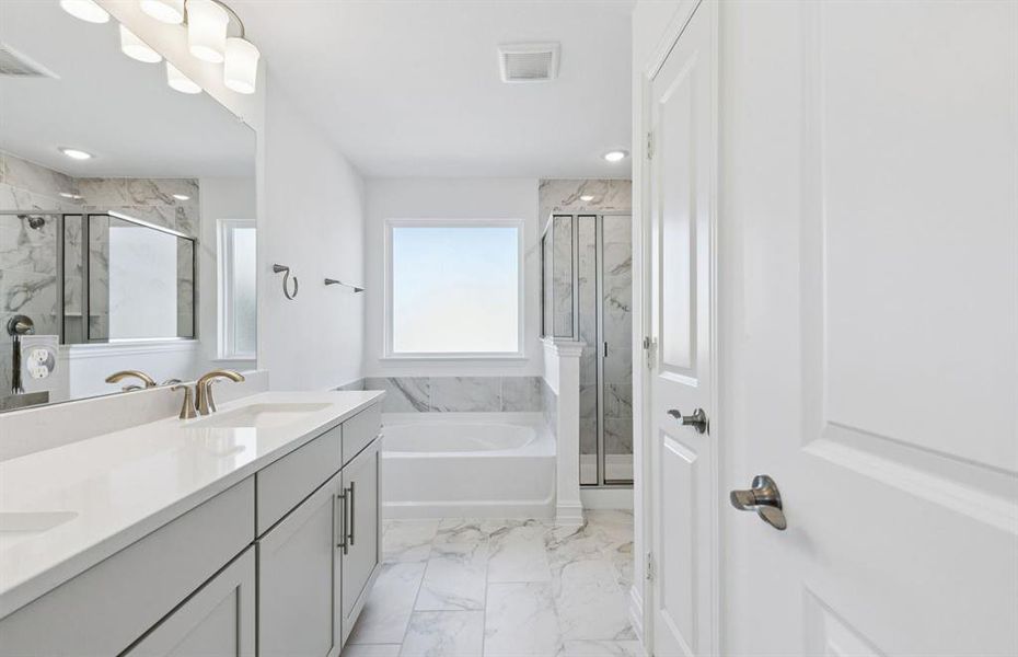 Owner's private bath with double vanity