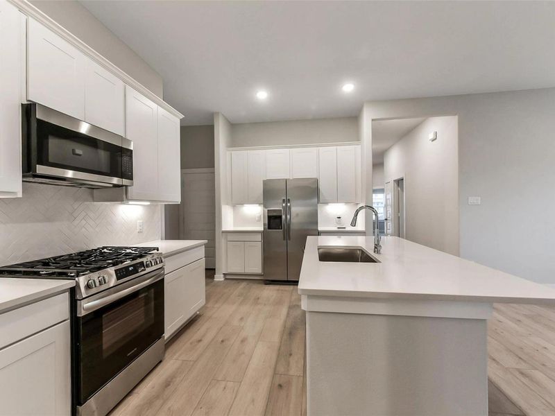 Furnished interior view inside a new home in Sunterra, Katy (Image 9).