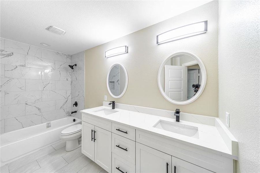 Bathroom with double vanity and  shower combination