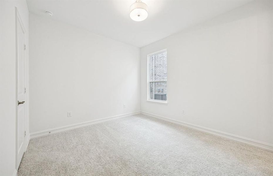 Roomy secondary bedroom with extensive closet storage Roomy secondary bedroom with extensive closet storage