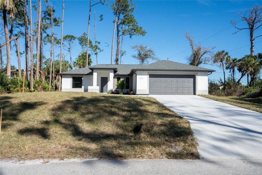 Front exterior of a new home in , Punta Gorda, FL, highlighting curb appeal (Image 1). Front exterior of a new home in , Punta Gorda, FL, highlighting curb appeal (Image 1).