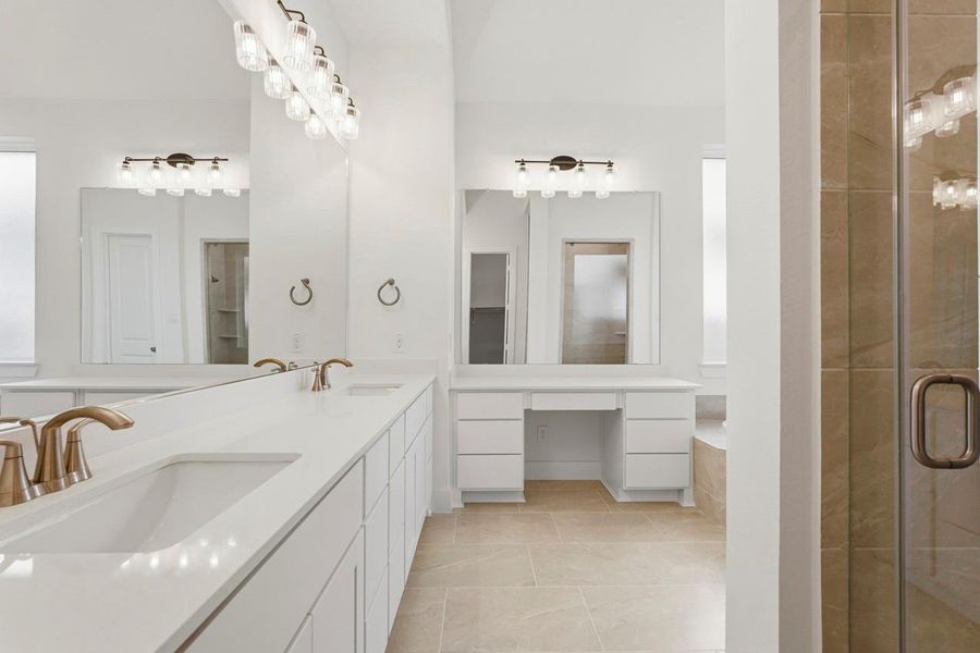 Primary Bathroom features a separate vanity area to get ready.